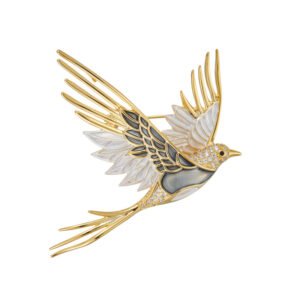 Enamel bird brooch wholesale featuring a soaring swallow silhouette with glossy enamel wings, pavé cubic zirconia head accents, and long tail feathers in gold and silver plating from junejewelry.com