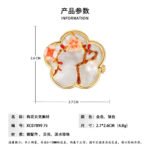 Oriental vintage Chinese style mother of pearl plum blossom brooch wholesale featuring a scalloped natural white shell base overlaid with pink enamel plum blossoms, branches, and a freshwater pearl in gold or silver finish from junejewelry.com