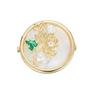 Chinese style enamel chrysanthemum pearl brooch wholesale featuring a circular natural mother of pearl disc, delicate wirework chrysanthemum with green enamel leaf, cubic zirconia sparkles, and a freshwater pearl from junejewelry.com