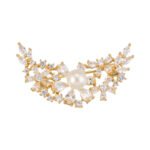 Delicate crescent moon pearl crystal brooch wholesale featuring a sweeping crescent arc encrusted with marquise and pear-cut cubic zirconia floral clusters centered around a smooth pearl accent from junejewelry.com