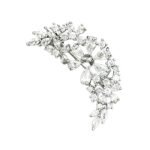 Sparkly silver curved floral CZ cluster brooch wholesale featuring brilliant pear-cut, marquise-cut, and round cubic zirconia stones in an arching vine design from junejewelry.com