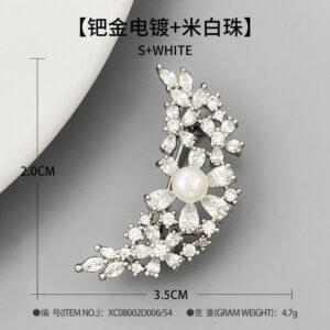 Delicate crescent moon pearl crystal brooch wholesale featuring a sweeping crescent arc encrusted with marquise and pear-cut cubic zirconia floral clusters centered around a smooth pearl accent from junejewelry.com