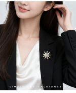 Elegant icy winter style snowflake CZ brooch wholesale featuring brilliant marquise-cut cubic zirconia petals and round CZ accent tips from junejewelry.com