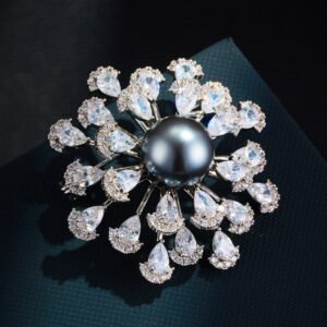 Luxurious pearl floral crystal brooch wholesale featuring a large center pearl surrounded by radiating wire-set pear-cut cubic zirconia petals from junejewelry.com