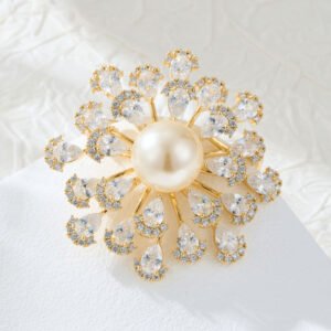 Luxurious pearl floral crystal brooch wholesale featuring a large center pearl surrounded by radiating wire-set pear-cut cubic zirconia petals from junejewelry.com