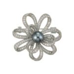 Pearl bloom brooch wholesale featuring micro-pavé cubic zirconia looped petals with a round center pearl in gold and silver finishes from junejewelry.com