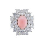 Light luxury pink queen conch shell magnetic brooch wholesale featuring an oval pink shell center surrounded by brilliant round and pear-cut cubic zirconia crystals with a strong magnetic clasp from junejewelry.com