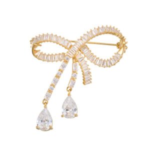 Elegant bow knot crystal brooch wholesale featuring a channel-set baguette cubic zirconia ribbon knot with dangling pear-cut CZ teardrop pendants and a convertible back hook from junejewelry.com