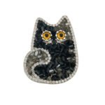 Cute and sparkling black crystal cat brooch wholesale featuring a cat silhouette studded with faceted black resin crystals, micro-pave cubic zirconia border, and vibrant amber eyes from junejewelry.com