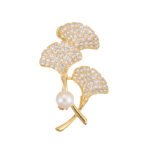 Ginkgo leaf pearl brooch wholesale featuring three pavé cubic zirconia fan-shaped ginkgo leaves, a smooth freshwater pearl accent, and a convertible back hook from junejewelry.com