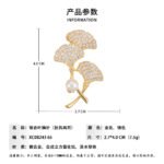 Ginkgo leaf pearl brooch wholesale featuring three pavé cubic zirconia fan-shaped ginkgo leaves, a smooth freshwater pearl accent, and a convertible back hook from junejewelry.com