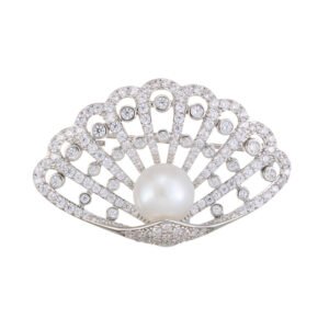 Seashell pearl crystal brooch wholesale featuring an openwork scalloped fan frame encrusted with pavé and bezel-set cubic zirconia, a center freshwater pearl, and a convertible back hook from junejewelry.com