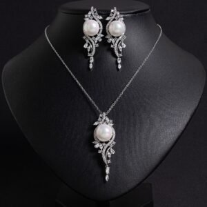 Niche pearl crystal vine jewelry set wholesale featuring a lustrous synthetic pearl encircled by an asymmetric marquise crystal vine motif with matching drop earrings from junejewelry.com