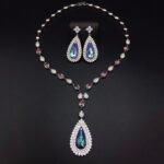 Silver statement necklace and drop earrings jewelry set with teardrop Swarovski Element crystals and pave halo wholesale