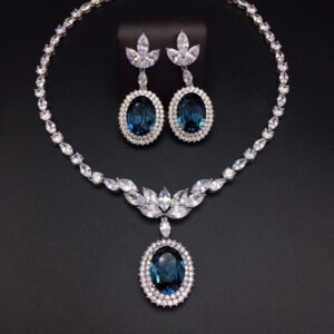 Silver statement necklace and drop earrings set with leaf motif and oval cut Swarovski Element crystals wholesale