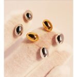 Wholesale chunky oval pebble stud earrings with 18K gold, white gold, and silver plating on copper