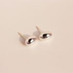 Wholesale chunky oval pebble stud earrings with 18K gold, white gold, and silver plating on copper