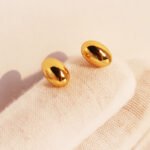 Wholesale chunky oval pebble stud earrings with 18K gold, white gold, and silver plating on copper
