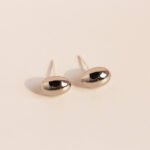 Wholesale chunky oval pebble stud earrings with 18K gold, white gold, and silver plating on copper