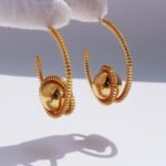 Wholesale sculptural spiral coil metallic orb hoop earrings with genuine 18K gold and white gold plating on copper