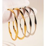 Wholesale large twisted wave hoop earrings with genuine 18K gold and white gold plating on copper