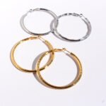 Wholesale classic textured bamboo wavy hoop earrings in multiple sizes with genuine 18K gold and white gold plating on copper Product Description
