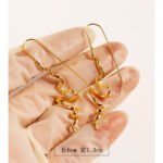 Wholesale wave spiral twist long drop earrings with genuine 18K gold and white gold plating on copper