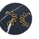 Wholesale bold abstract folded ribbon swirl statement earrings with genuine 18K gold and white gold plating on copper