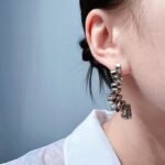 Wholesale bold abstract folded ribbon swirl statement earrings with genuine 18K gold and white gold plating on copper