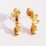 Wholesale bold abstract folded ribbon swirl statement earrings with genuine 18K gold and white gold plating on copper