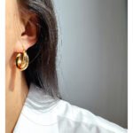 Wholesale modern twisted crossover intertwined hoop earrings with genuine 18K gold and white gold plating on copper