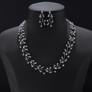 Vine crystal jewelry set wholesale featuring delicate branch motif collar necklace with baguette crystal buds and matching dangle earrings on palladium plated copper.