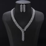 Y-Necklace Crystal Set Wholesale featuring marquise cut leaf motif Y-necklace collar with dangling crystal drop tail and matching earrings on palladium plated copper base.