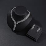 Y-Necklace Crystal Set Wholesale featuring marquise cut leaf motif Y-necklace collar with dangling crystal drop tail and matching earrings on palladium plated copper base.