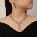 Y-Necklace Crystal Set Wholesale featuring marquise cut leaf motif Y-necklace collar with dangling crystal drop tail and matching earrings on palladium plated copper base.