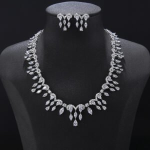 Wave crystal jewelry set wholesale featuring arched pavé link collar necklace with dangling marquise and pear cut crystal fringe tassels and matching drop earrings on palladium plated copper.