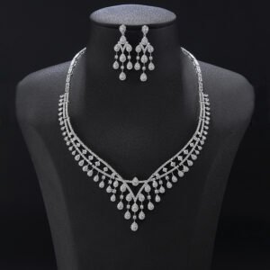 Chandelier crystal jewelry set wholesale featuring double arched pave collar necklace with multi-tier dangling crystal teardrop tassels and matching drop earrings on palladium plated copper.