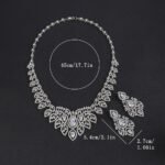 Crown crystal jewelry set wholesale featuring ornate filigree teardrop halo bib collar necklace with large pear cut crystal center and matching chandelier earrings on palladium plated copper base.