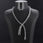 Y lariat crystal jewelry set wholesale featuring asymmetric emerald cut and pear cut crystal lariat necklace with dangling stream drop and matching earrings on palladium plated copper.
