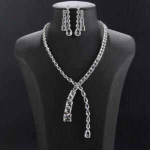 Y lariat crystal jewelry set wholesale featuring asymmetric emerald cut and pear cut crystal lariat necklace with dangling stream drop and matching earrings on palladium plated copper.