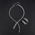 Y lariat crystal jewelry set wholesale featuring asymmetric emerald cut and pear cut crystal lariat necklace with dangling stream drop and matching earrings on palladium plated copper.