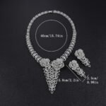 Rose blossom crystal jewelry set wholesale featuring 3D pave crystal dual rose flowers with dangling triangular leaf cluster pendant and matching drop earrings on palladium plated copper base.
