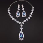 Silver statement necklace and drop earrings set with leaf motif and pear-cut Swarovski Element crystals wholesale