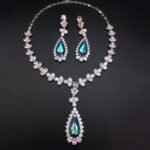 Silver statement necklace and drop earrings set with leaf motif and pear-cut Swarovski Element crystals wholesale