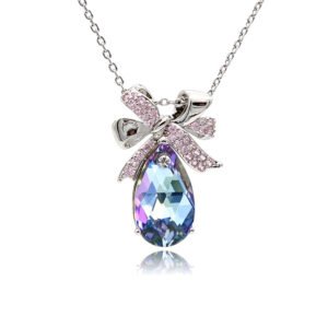 Silver ribbon bow pendant necklace with micro-pavé accents holding a teardrop Swarovski Element crystal wholesale