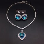 Silver tennis necklace and drop earrings set with heart cut Swarovski Element crystals and pave halo wholesale