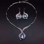 Silver tulip motif statement necklace and drop earrings jewelry set with teardrop Swarovski Element crystals wholesale