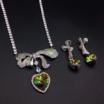 Silver tennis necklace and drop earrings set with pave bow and heart cut Swarovski Element crystals wholesale