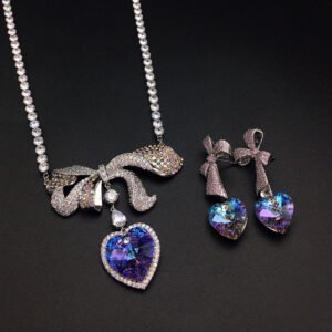 Silver tennis necklace and drop earrings set with pave bow and heart cut Swarovski Element crystals wholesale