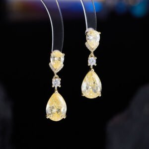 Teardrop crystal drop earrings wholesale featuring champagne yellow and lavender purple pear-cut cubic zirconia gems with micro-pave accents on 18k gold and palladium plated brass.